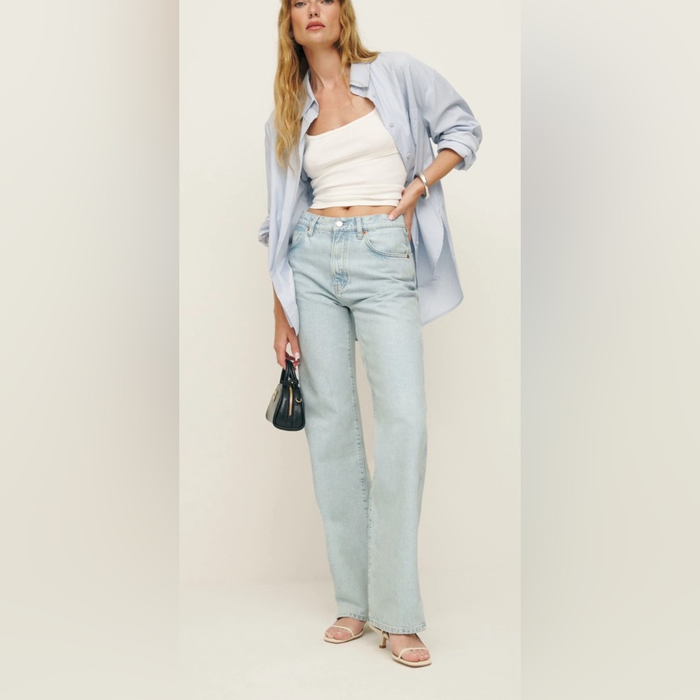 Reformation Val 90s Mid Rise Straight Jeans in Mooney Vented wash.